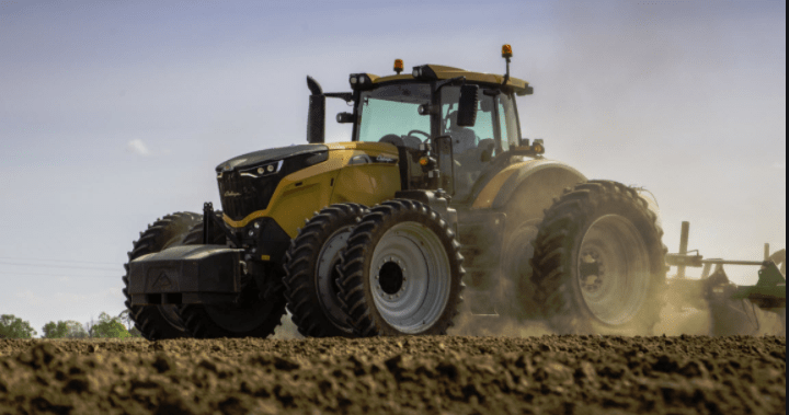 Agricultural Tractor plowing a field